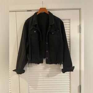 Black distress denim jacket.